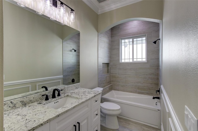bathroom featuring crown molding, shower / bathtub combination, toilet, and vanity