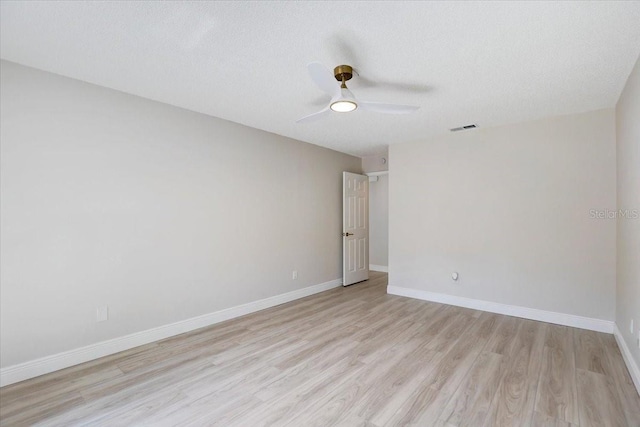 3404 33rd Street Ct W, Bradenton, FL 34205 - spare room with light wood-style floors, a ceiling fan, baseboards, and a textured ceiling