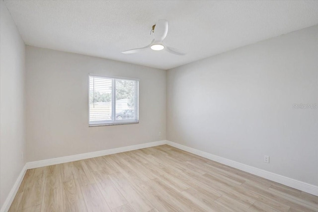3404 33rd Street Ct W, Bradenton, FL 34205 - spare room with light wood-style floors, ceiling fan, baseboards, and a textured ceiling
