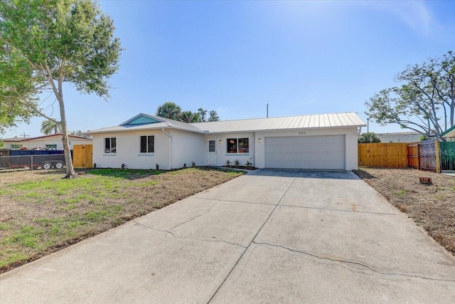 3404 33rd Street Ct W, Bradenton, FL 34205 - single story home with stucco siding, an attached garage, concrete driveway, and metal roof