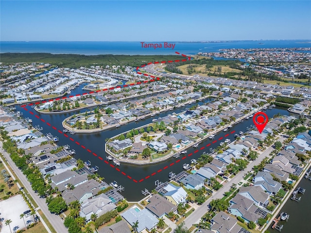 bird's eye view featuring a water view and a residential view