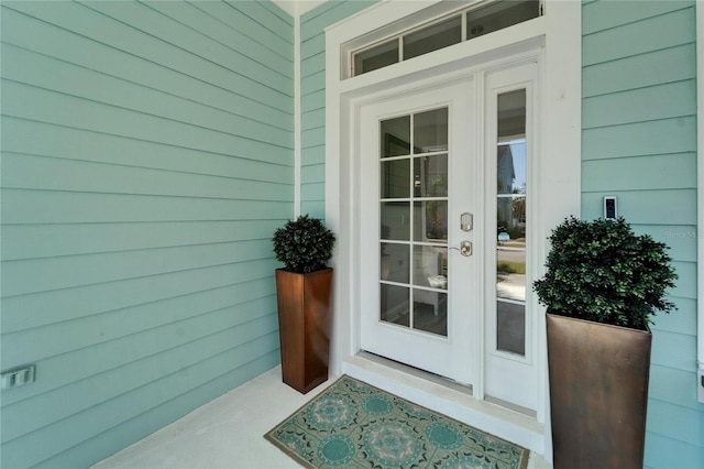 view of exterior entry featuring french doors