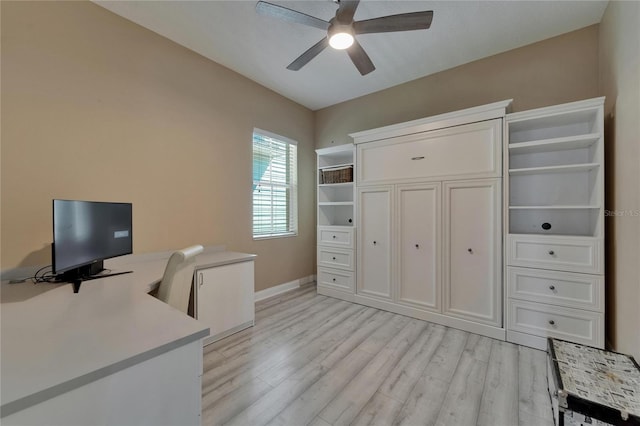 home office with light wood-style flooring, a ceiling fan, and baseboards