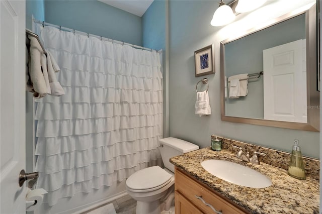 full bathroom featuring toilet, vanity, and shower / bath combination with curtain