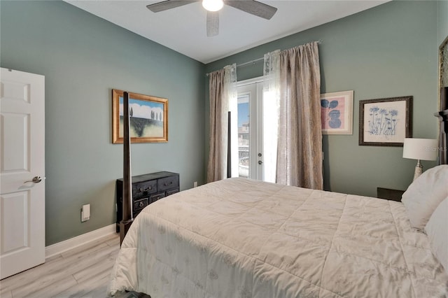 bedroom featuring french doors, wood finished floors, ceiling fan, and baseboards