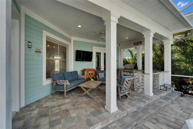 view of patio / terrace with area for grilling, ceiling fan, and outdoor lounge area