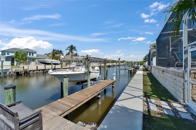 view of dock featuring a water view and boat lift