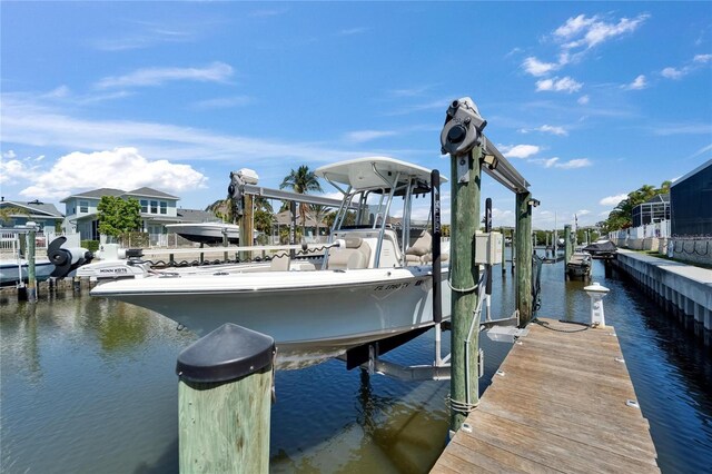 view of dock featuring a water view and boat lift