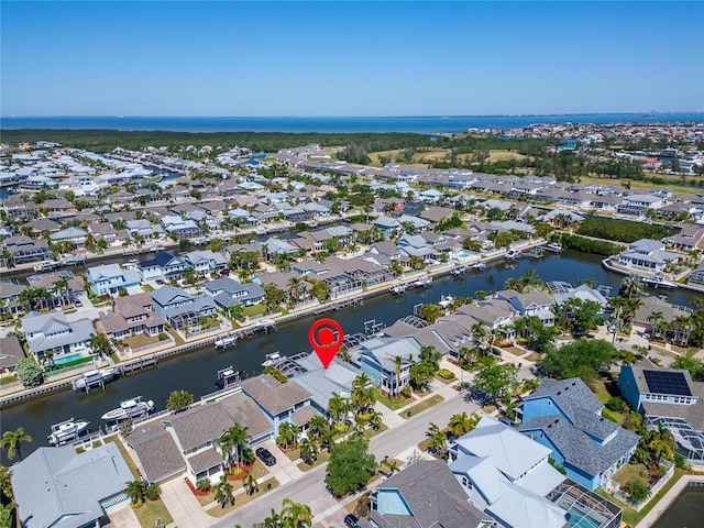 aerial view featuring a water view and a residential view
