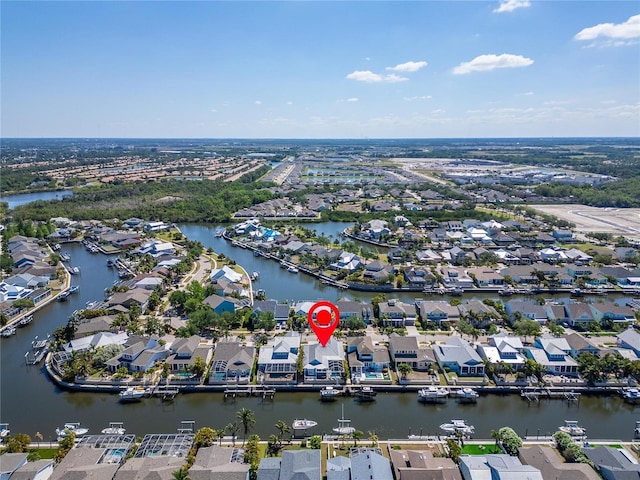 drone / aerial view with a residential view and a water view