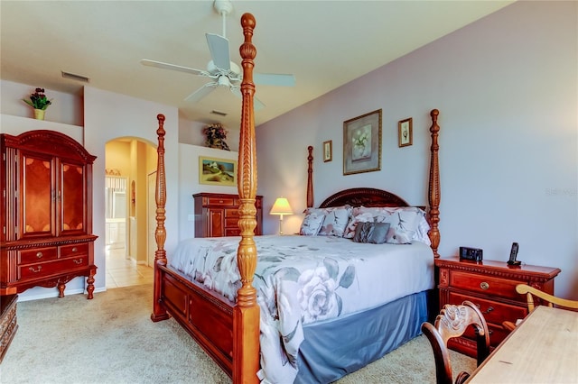 522 Planters Manor Way, Bradenton, FL 34212 - bedroom with arched walkways, carpet, a ceiling fan, and ensuite bathroom