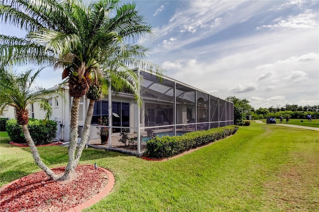 522 Planters Manor Way, Bradenton, FL 34212 - rear view of house featuring a lawn and a lanai