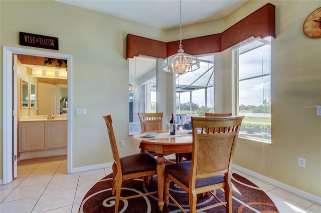 522 Planters Manor Way, Bradenton, FL 34212 - dining area featuring a chandelier, light tile patterned flooring, and plenty of natural light