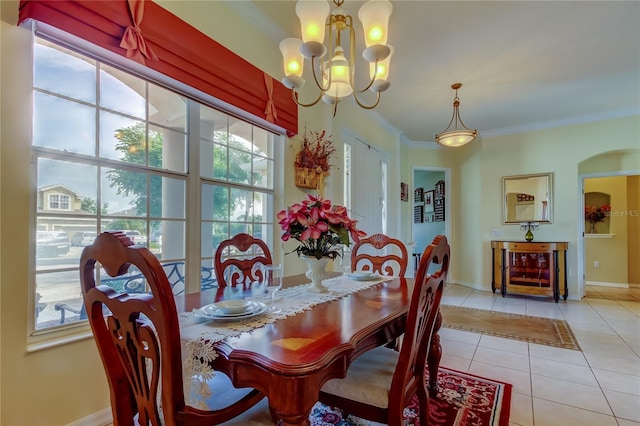 522 Planters Manor Way, Bradenton, FL 34212 - dining room with tile patterned floors, a chandelier, and crown molding