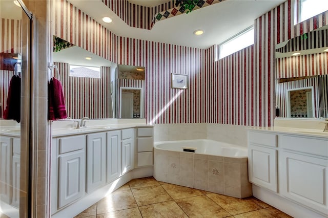 522 Planters Manor Way, Bradenton, FL 34212 - full bathroom featuring wallpapered walls, two vanities, a garden tub, tile patterned floors, and a shower stall