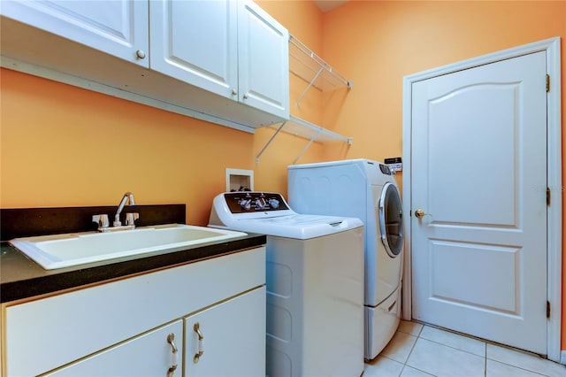522 Planters Manor Way, Bradenton, FL 34212 - washroom with cabinet space, washing machine and clothes dryer, and light tile patterned flooring