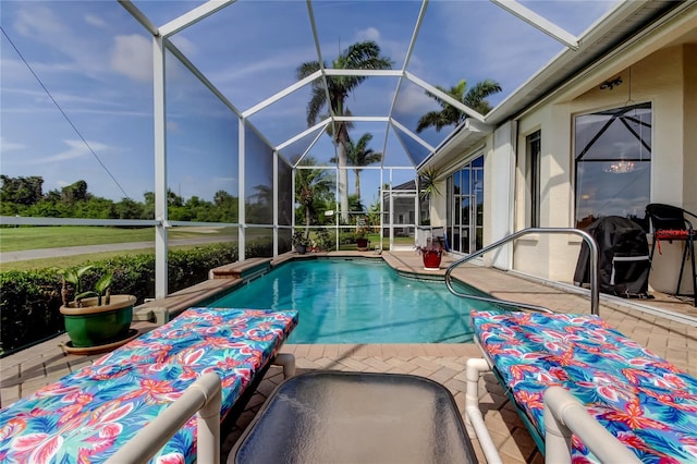 522 Planters Manor Way, Bradenton, FL 34212 - outdoor pool featuring a patio and glass enclosure