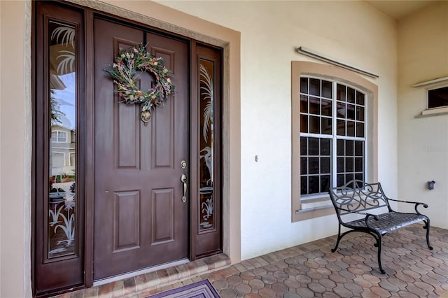 522 Planters Manor Way, Bradenton, FL 34212 - property entrance with stucco siding and covered porch