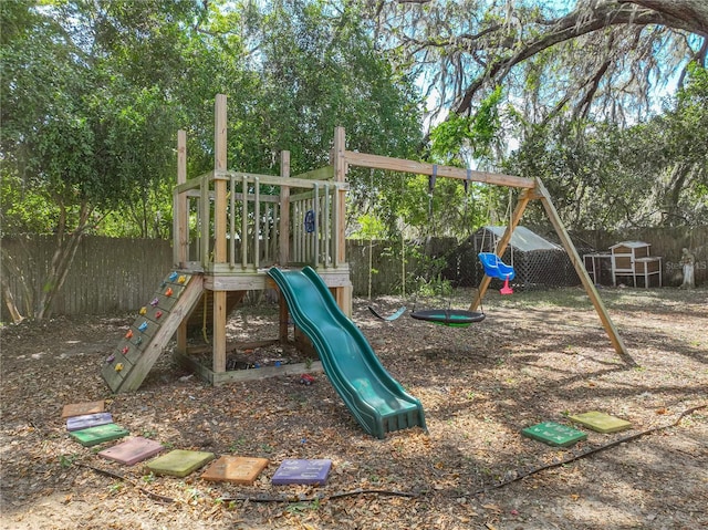 view of playground with a fenced backyard
