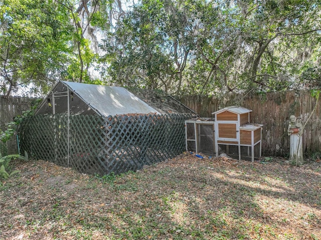 view of yard with an outdoor structure and exterior structure