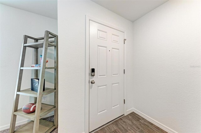 3879 E Price Blvd, North Port, FL 34288 - foyer entrance featuring dark wood-type flooring and baseboards
