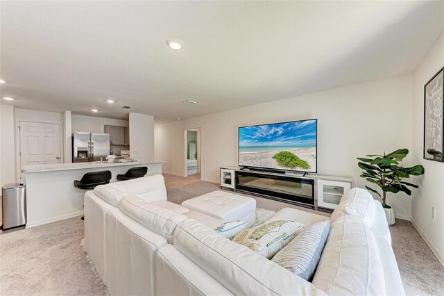 3879 E Price Blvd, North Port, FL 34288 - living room with recessed lighting, light colored carpet, and baseboards