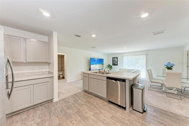 3879 E Price Blvd, North Port, FL 34288 - kitchen with open floor plan, light countertops, visible vents, appliances with stainless steel finishes, and a sink