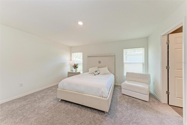 3879 E Price Blvd, North Port, FL 34288 - carpeted bedroom featuring recessed lighting, multiple windows, and baseboards