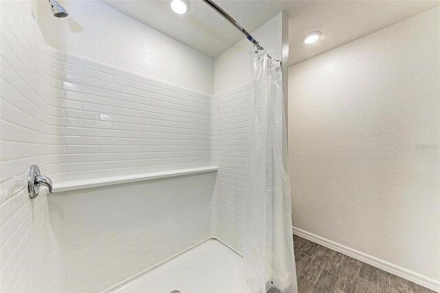3879 E Price Blvd, North Port, FL 34288 - bathroom featuring recessed lighting, baseboards, a shower stall, and wood finished floors