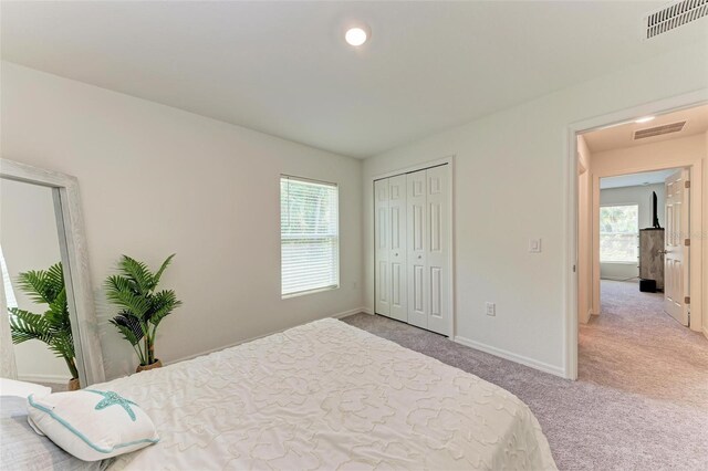 3879 E Price Blvd, North Port, FL 34288 - bedroom featuring a closet, visible vents, light colored carpet, and baseboards
