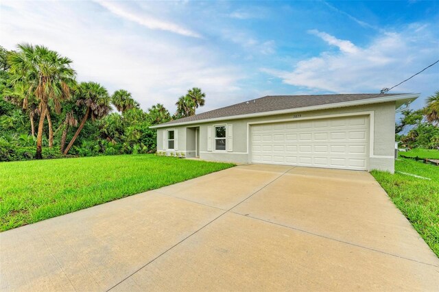 3879 E Price Blvd, North Port, FL 34288 - single story home with a front yard, an attached garage, driveway, and stucco siding