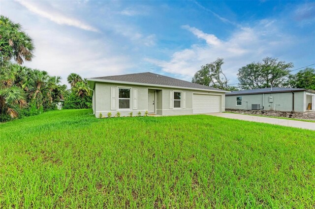 3879 E Price Blvd, North Port, FL 34288 - single story home featuring concrete driveway, a front yard, stucco siding, and an attached garage