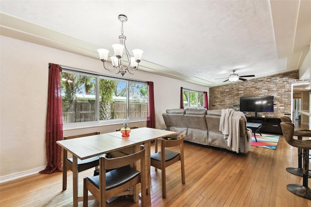 422 Dunedin Cir, Temple Terrace, FL 33617 - dining area with baseboards, ceiling fan with notable chandelier, and light wood finished floors