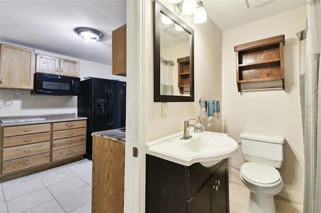 422 Dunedin Cir, Temple Terrace, FL 33617 - bathroom featuring vanity, tile patterned flooring, and toilet