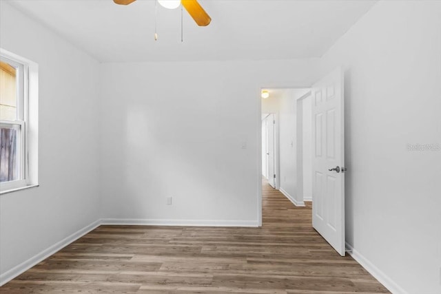 15118 Brushwood Dr, Tampa, FL 33624 - spare room featuring ceiling fan, wood finished floors, and baseboards