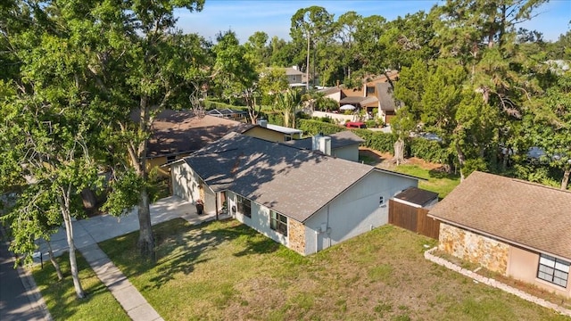 15118 Brushwood Dr, Tampa, FL 33624 - view of subject property with a tree filled landscape