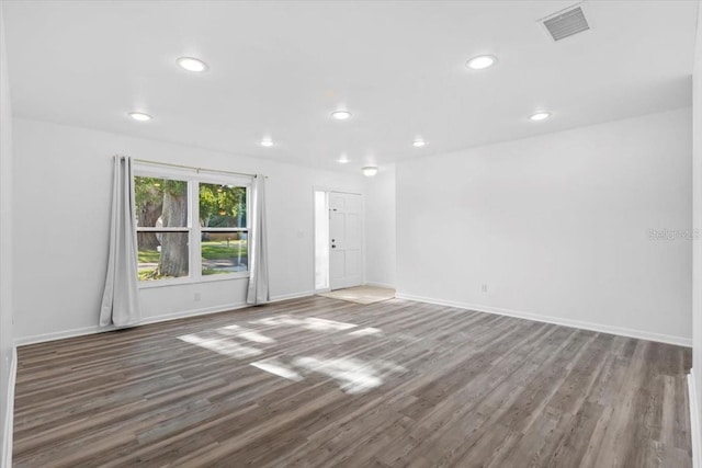 15118 Brushwood Dr, Tampa, FL 33624 - spare room featuring wood finished floors, recessed lighting, and baseboards
