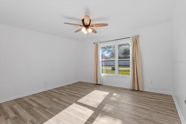 15118 Brushwood Dr, Tampa, FL 33624 - unfurnished room with ceiling fan, wood finished floors, and baseboards