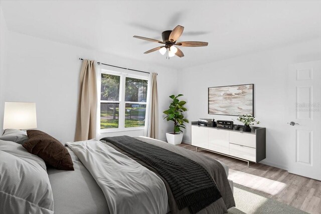 15118 Brushwood Dr, Tampa, FL 33624 - bedroom featuring light wood-type flooring and a ceiling fan