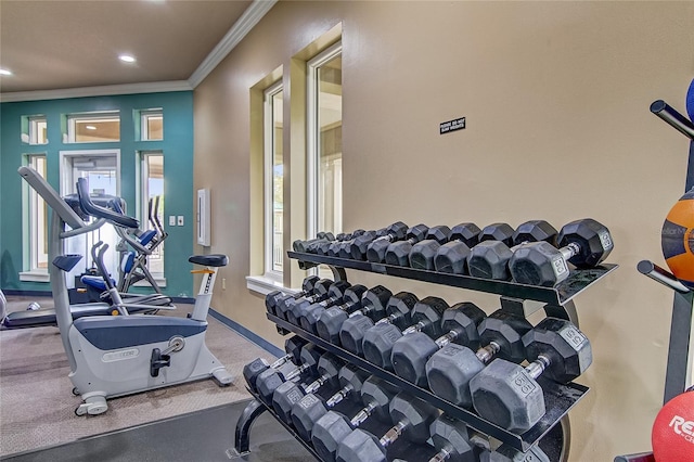 workout area with ornamental molding, recessed lighting, carpet flooring, and baseboards