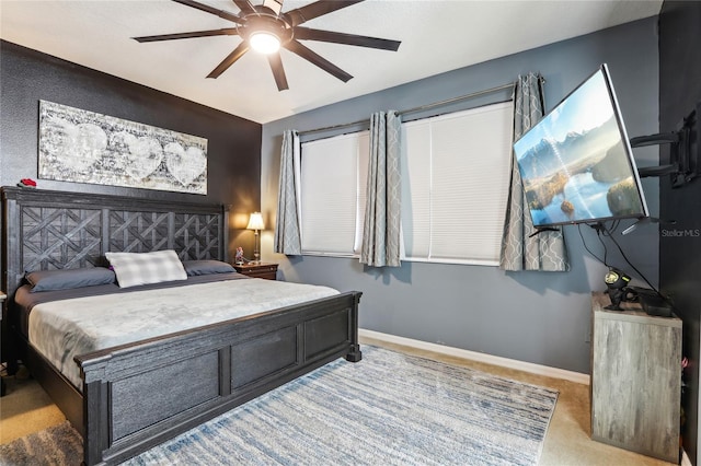 bedroom featuring carpet, baseboards, and ceiling fan