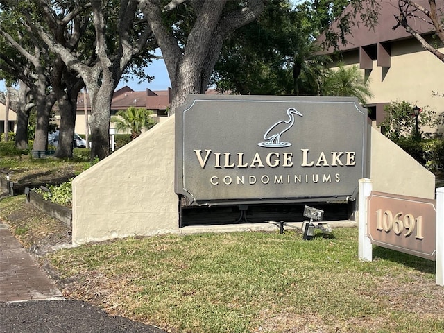 825 S Village Dr N Unit 201, Saint Petersburg, FL 33716 - community / neighborhood sign featuring a lawn