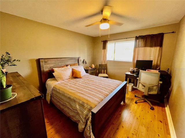 825 S Village Dr N Unit 201, Saint Petersburg, FL 33716 - bedroom with wood finished floors, a ceiling fan, and an office area