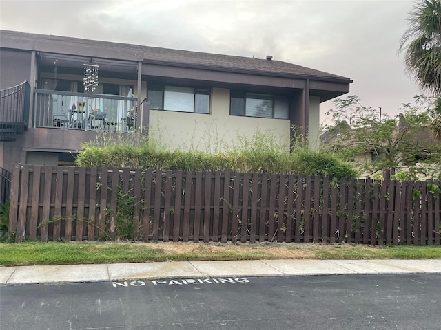 825 S Village Dr N Unit 201, Saint Petersburg, FL 33716 - view of side of property with fence and stucco siding