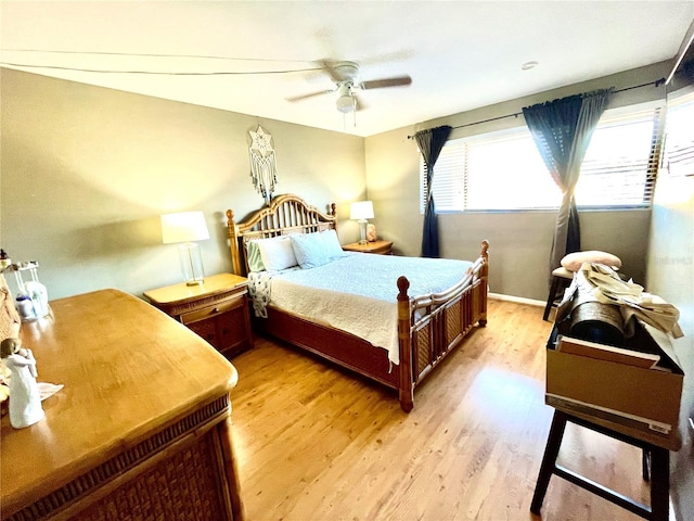 825 S Village Dr N Unit 201, Saint Petersburg, FL 33716 - bedroom with multiple windows, light wood-type flooring, and ceiling fan