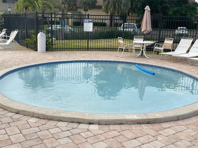 825 S Village Dr N Unit 201, Saint Petersburg, FL 33716 - community pool featuring fence and a patio