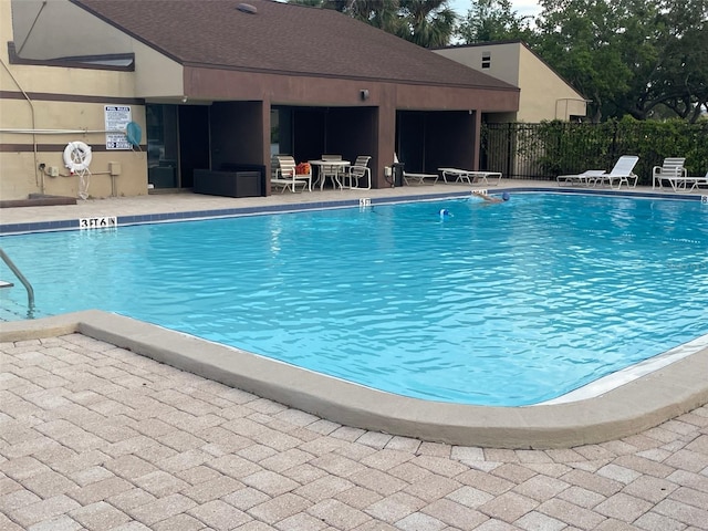 825 S Village Dr N Unit 201, Saint Petersburg, FL 33716 - community pool featuring fence and a patio area