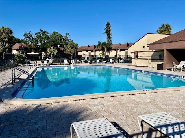 825 S Village Dr N Unit 201, Saint Petersburg, FL 33716 - community pool with fence and a patio