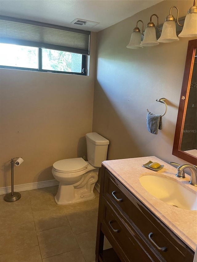 825 S Village Dr N Unit 201, Saint Petersburg, FL 33716 - half bath featuring vanity, toilet, and tile patterned flooring