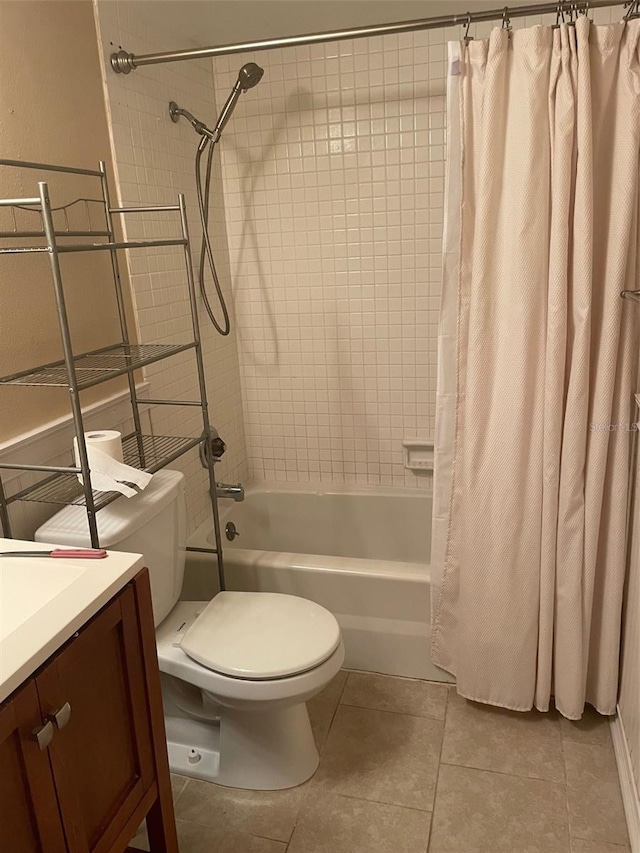 825 S Village Dr N Unit 201, Saint Petersburg, FL 33716 - bathroom featuring tile patterned flooring, shower / bath combination with curtain, toilet, and vanity